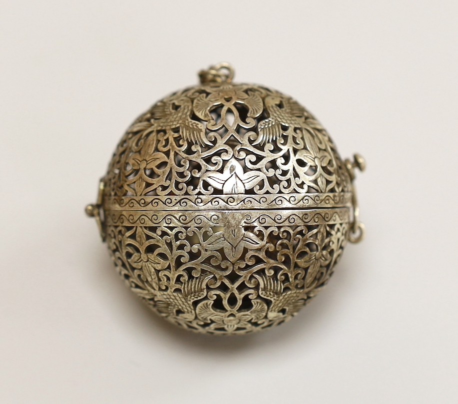 A Chinese spherical ornately worked metal perfume holder, 5.2cm